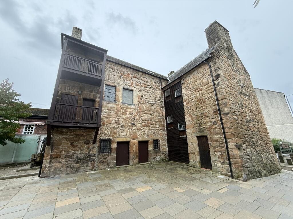 The stone courtyard front of Loudoun Hall, with its timber gallery